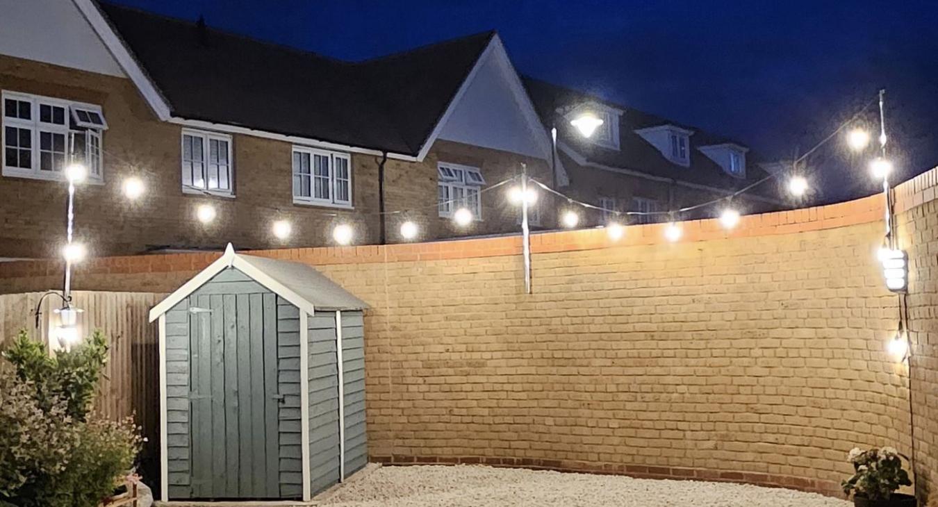 Festoon lighting added to garden in Rochester by Eru Electrics